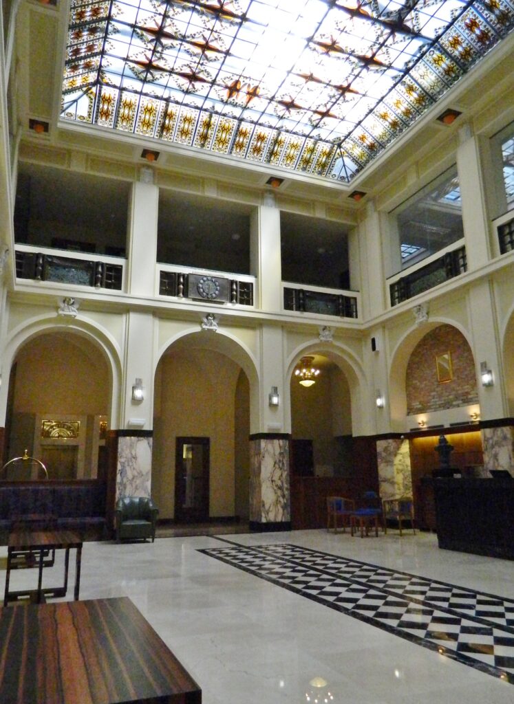Atrium Grandezza Hotel Luxury Palace with archway and marble floor