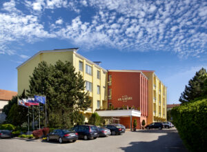 View of the Akademie hotel building and the adjacent parking lot