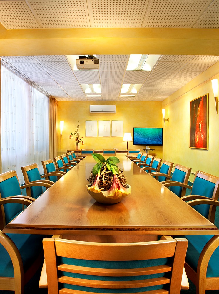 A conference room in the academy hotel with an i-shaped meeting schedule