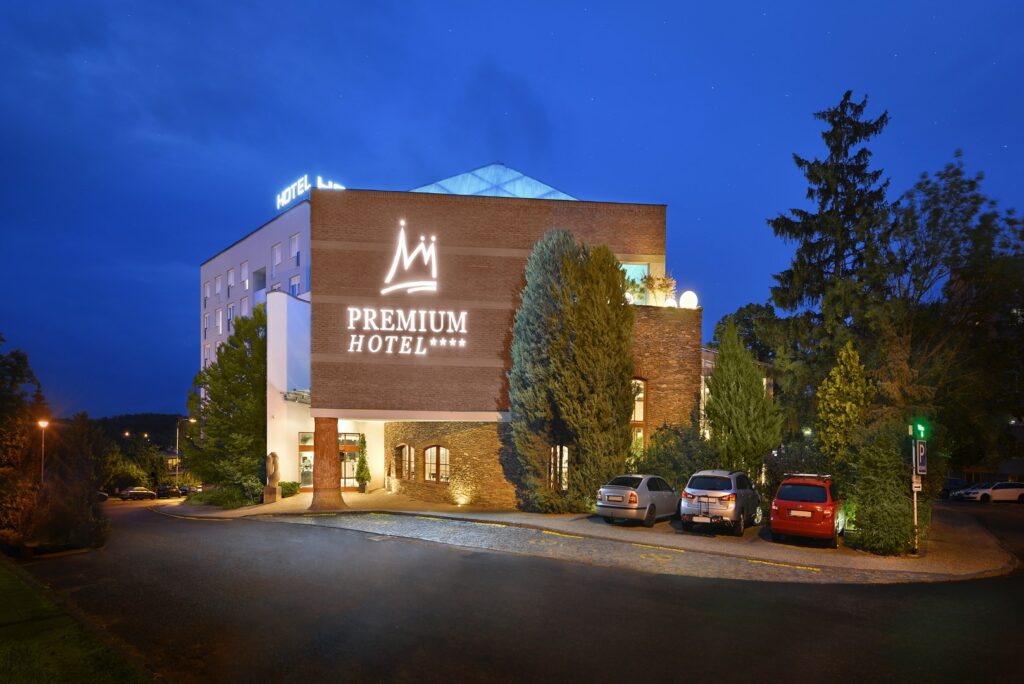 Night view of the illuminated Premium Hotel Znojmo building