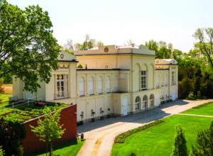 Side view of the Chateau de Frontiere with garden in summer